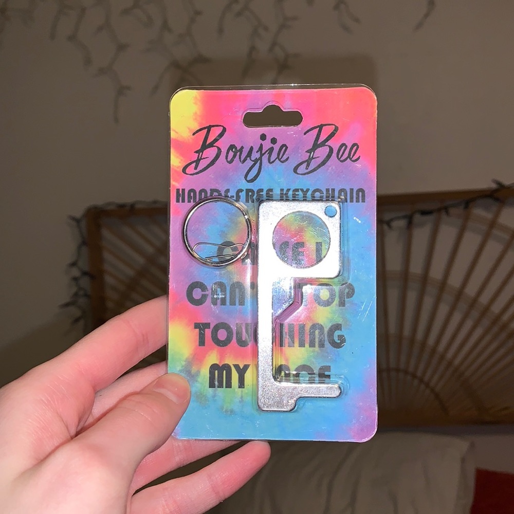 NEW IN PACKAGING door opening key chain. great to keep covid away!!